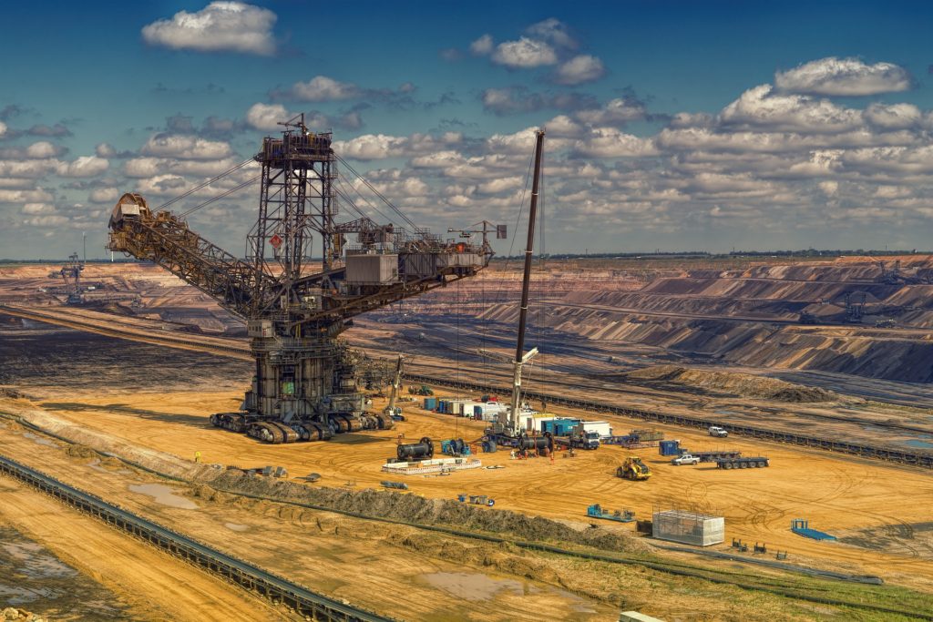 Large-scale mining equipment operating in an open-pit mine with high-load bearing applications.