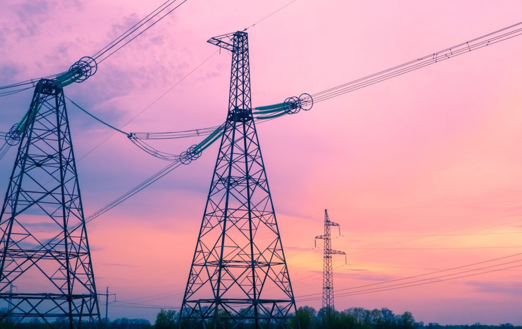 Electrical power transmission infrastructure supported by industrial bearing systems.